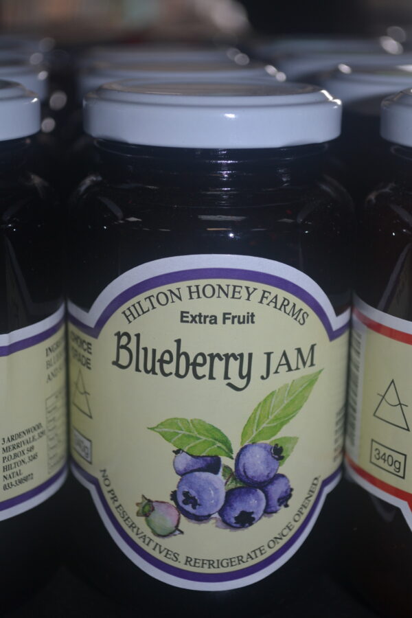 340g jar of Hilton Farms' Blueberry Jam with a deep purple colour, made from handpicked blueberries in the Kwazulu Natal Midlands.