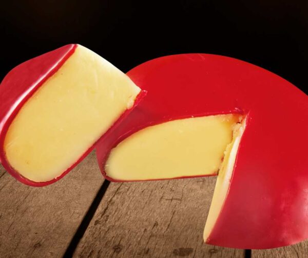 A block of creamy Gouda cheese, showcasing its smooth texture and slightly sweet, nutty flavour.